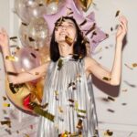 Fashionable Celebrations - Woman Looking at Falling Confetti