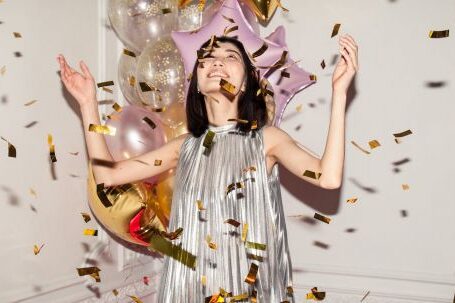 Fashionable Celebrations - Woman Looking at Falling Confetti