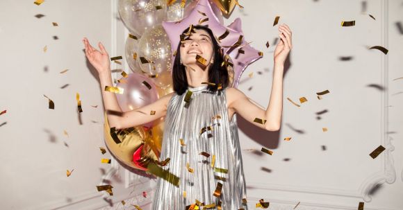 Fashionable Celebrations - Woman Looking at Falling Confetti