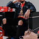 Fashion Brands - Man Sitting on Black Sofa Chair