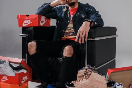 Fashion Brands - Man Sitting on Black Sofa Chair