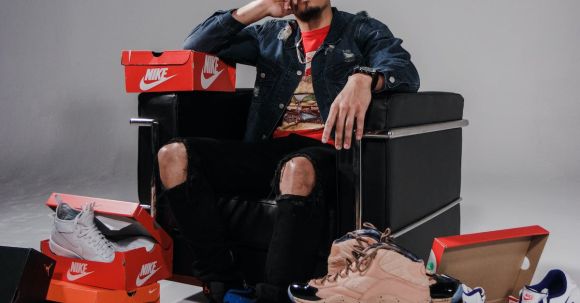 Fashion Brands - Man Sitting on Black Sofa Chair