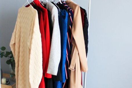 Stylish Outerwear - Assorted-colored Dresses on White Clothes Rack