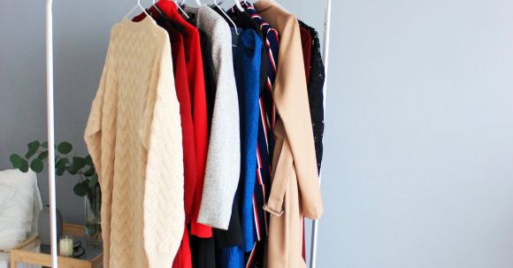 Stylish Outerwear - Assorted-colored Dresses on White Clothes Rack