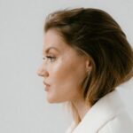 Business Style - Side View of a Woman Wearing White Coat