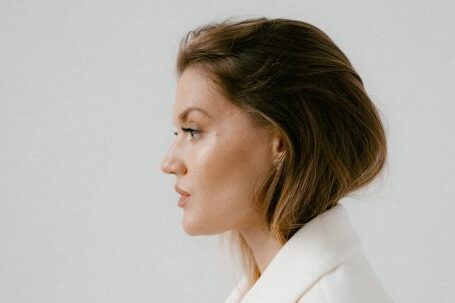 Business Style - Side View of a Woman Wearing White Coat