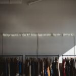 Sustainable Fashion - assorted clothes lot on gray clothes racks